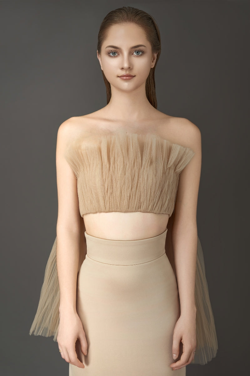 Phan Huy nude pleated top and pencil skirt co-ord set displayed on a model, showcasing stylish matching fashion ensemble.