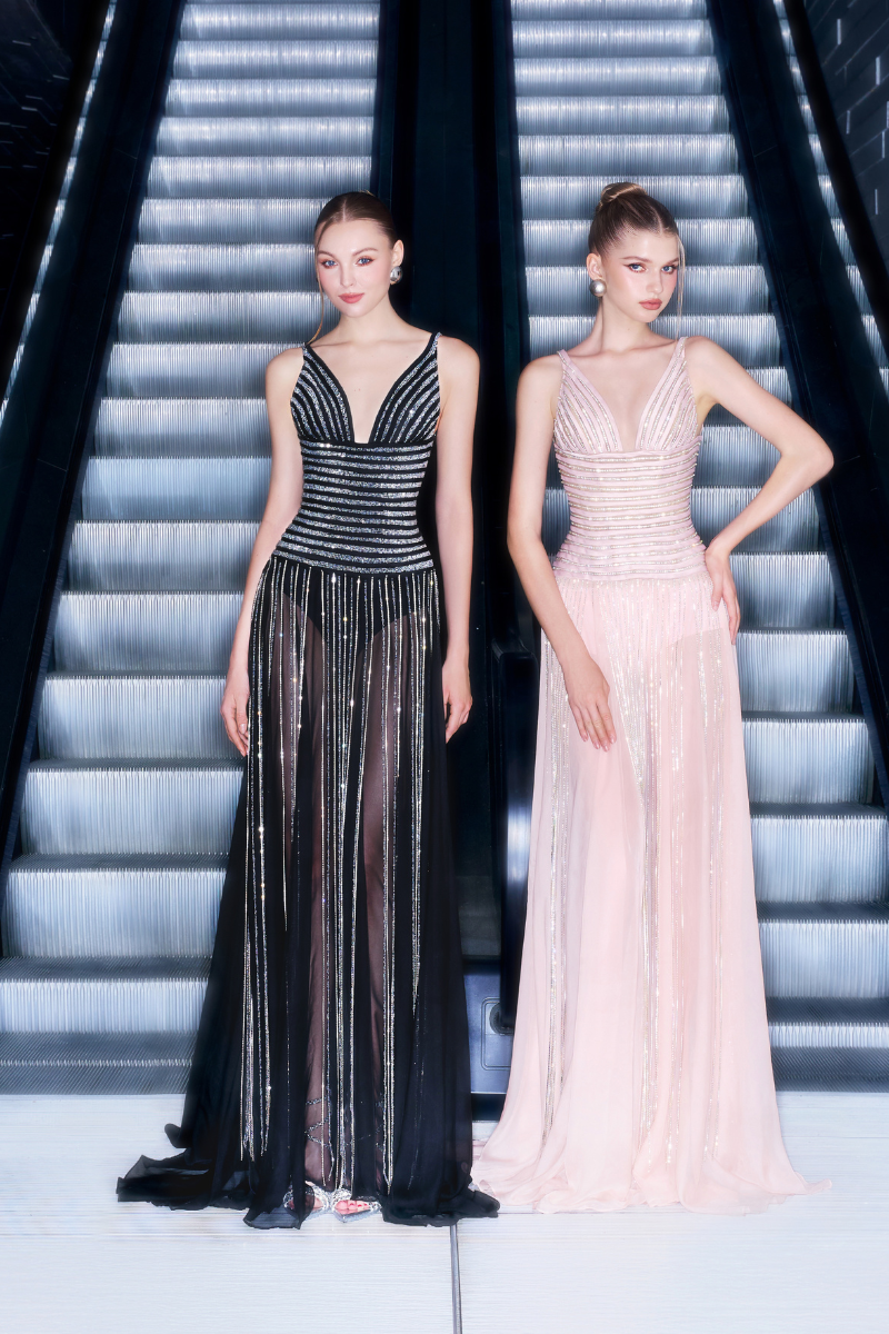 Black striped beaded gown by CEM featuring intricate beadwork and elegant design, showcased on a model.