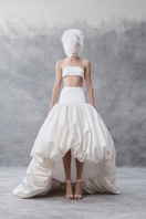 White draped bandeau top and balloon skirt co-ords by Phan Huy, styled together in a fashionable outfit.
