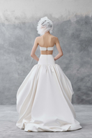 White draped bandeau top and balloon skirt co-ord set by Phan Huy, featuring elegant fabric and modern design.