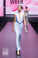 Blue velvet drape gown by CEM, elegant floor-length gown with flowing fabric and sophisticated design, shown on a dress form.
