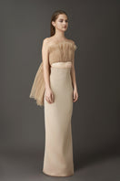 Nude pleated co-ord set with a top and pencil skirt from Phan Huy, shown on a hanger, showcasing the stylish and elegant design.