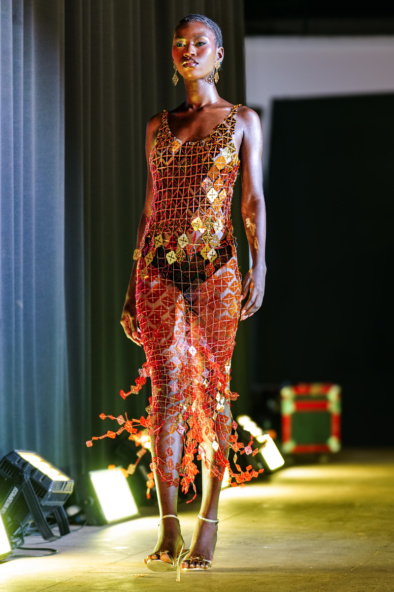 Onalaja Onalaja Sequin Emblem Slip Top featuring shimmering sequins and a stylish design, shown in a close-up image.