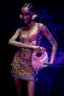 Onalaja Iris multi crop top with colorful patterns, featuring a stylish, fitted design perfect for casual or trendy outfits.