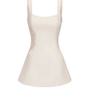 White Nana Jacqueline Selena mini dress, sleeveless with a fitted bodice and flared skirt, displayed on a hanger.