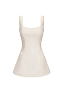 White Nana Jacqueline Selena mini dress, sleeveless with a fitted bodice and flared skirt, displayed on a hanger.