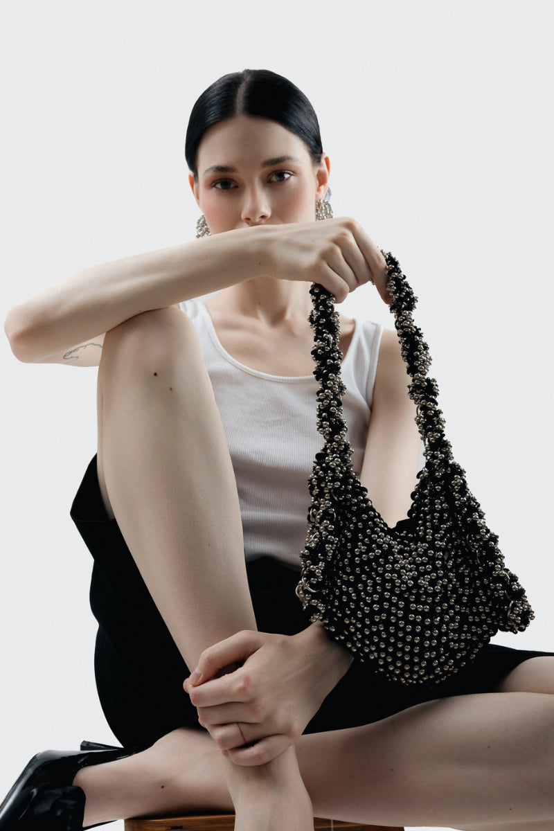 Millanne Tale ADHAR Bag top handle bag with sleek design and sturdy handles, perfect for stylish everyday use.