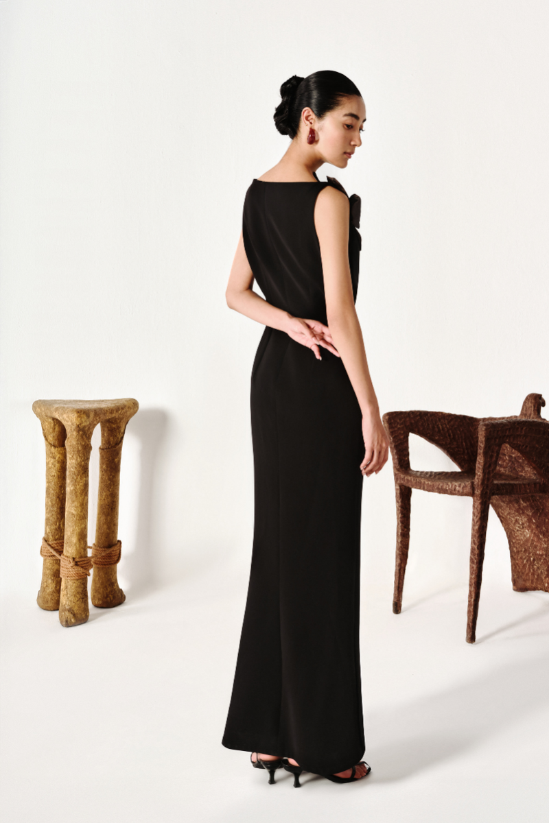 Elegant floral satin crepe gown by Levia featuring a flowing silhouette and intricate floral patterns.