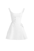 White corset A-line mini dress from Stolen Stores, featuring a fitted bodice and flared skirt, shown on a mannequin.