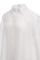 Light blue LECIA oversize organza shirt with a loose fit and sheer fabric, shown on a hanger.