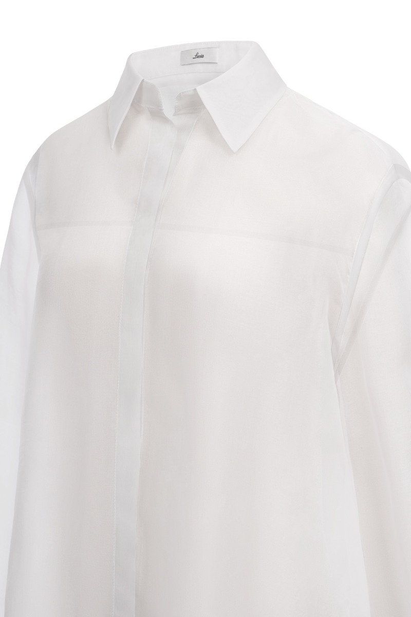 Light blue LECIA oversize organza shirt with a loose fit and sheer fabric, shown on a hanger.