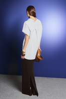 Black long pencil skirt by Levia, maxi skirt style, shown with a high-waisted fit and sleek fabric for a stylish look.