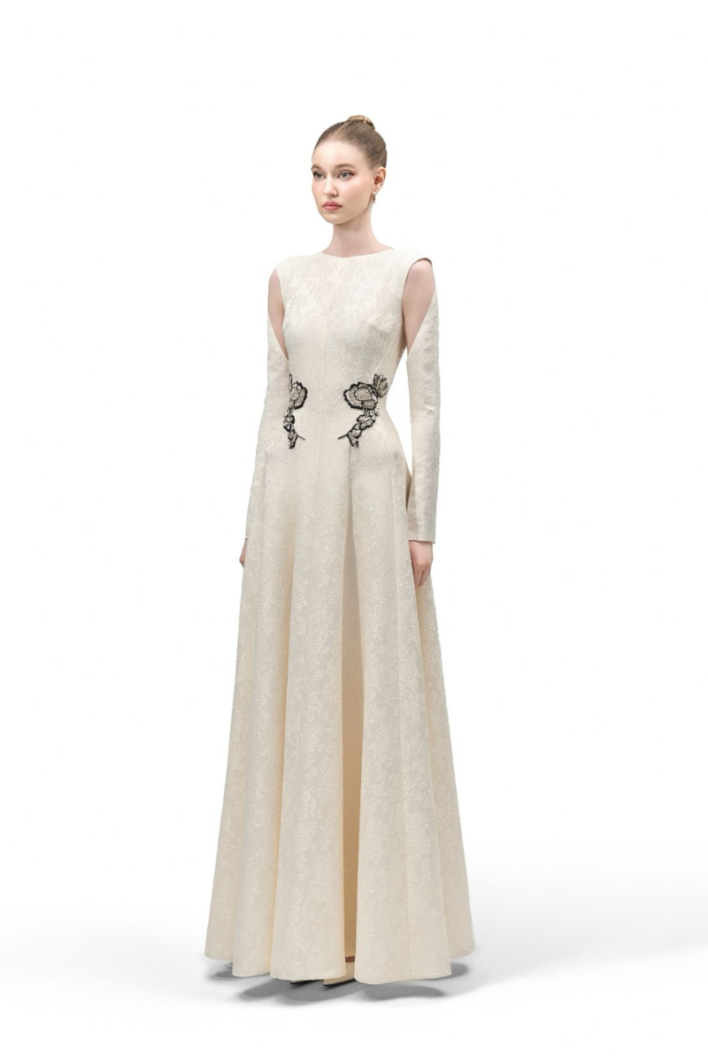 Maison Des Copains celestial blue A-line gown with cold shoulder lace sleeves and a floor-length design.