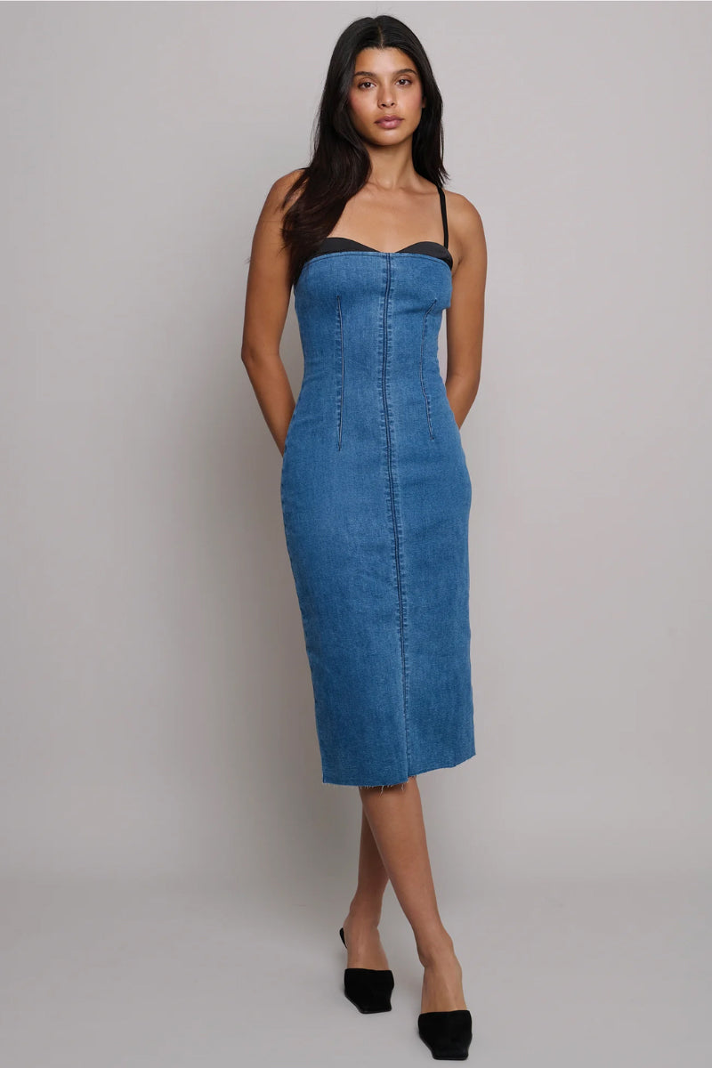 Victoria dress by TT Studios, a stylish midi dress with a flowy fabric and elegant design, shown in a natural pose.