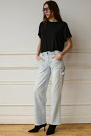 Blue Jade Jeans by TT Studios, showing the fitted denim jeans with classic five-pocket design and stylish stitching.