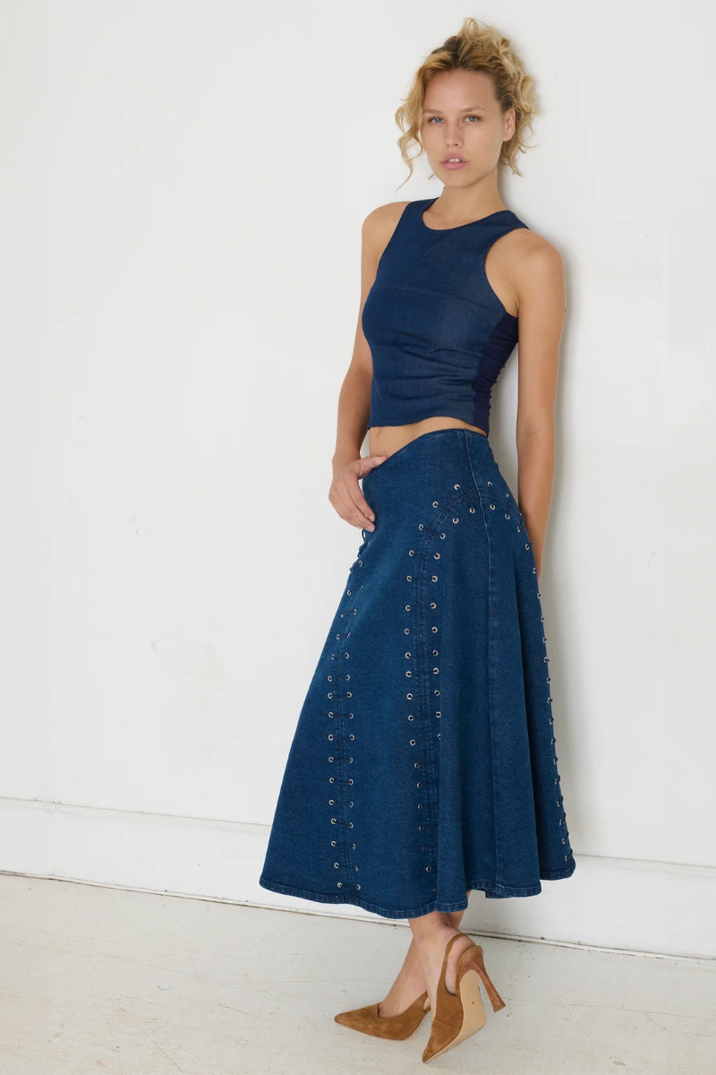 TT Studios JAN midi skirt with a stylish design, featuring a flowy fabric and an elegant silhouette visible in the image.