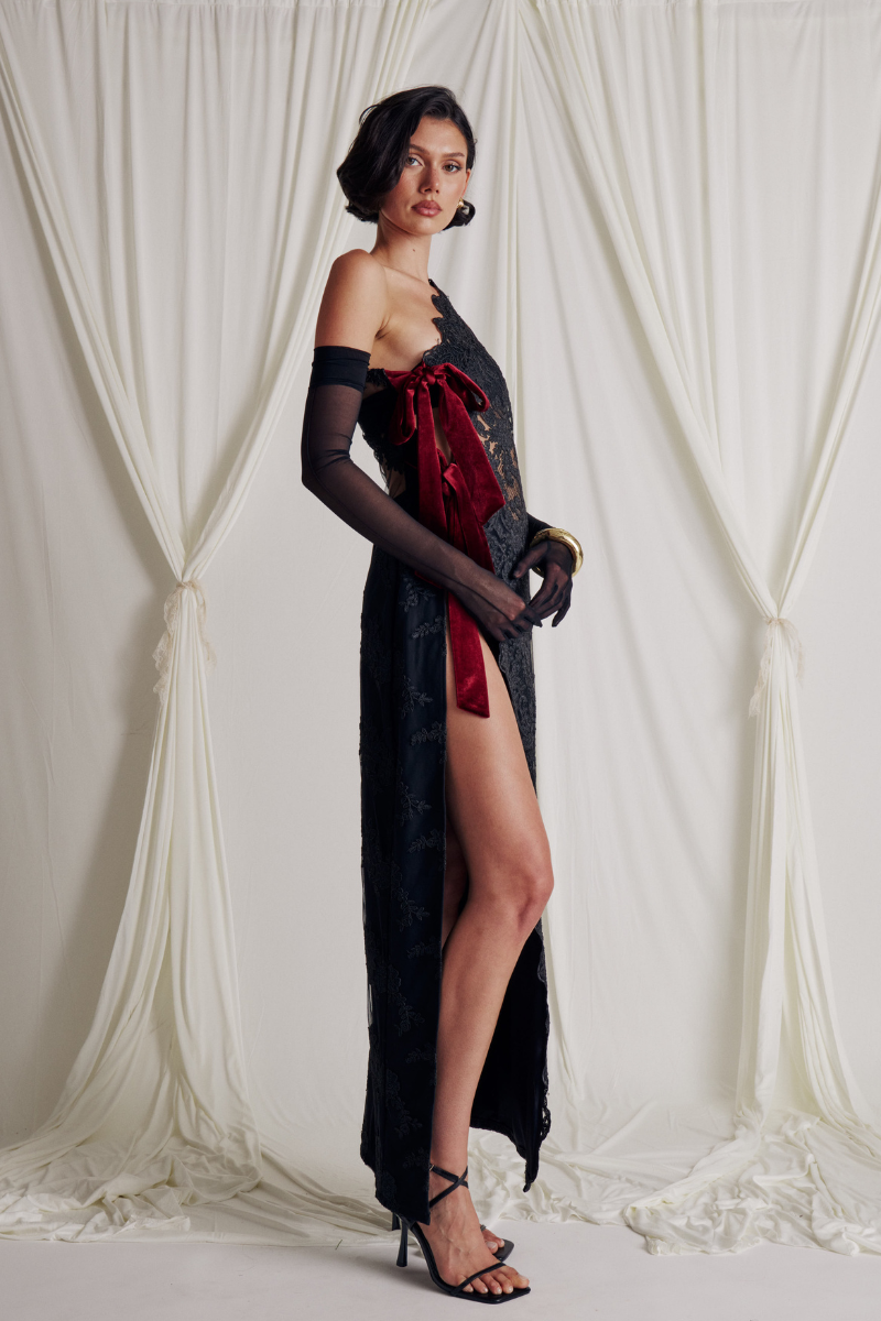 Elegant VITA GOWN by Somebodée featuring a flowing design and intricate detailing, perfect for formal occasions.