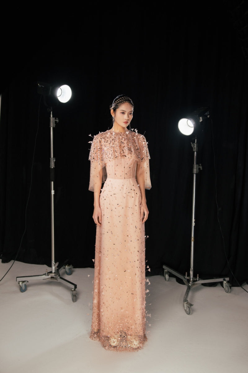 Pink crystal-embellished mesh gown from Happy Clothing featuring a flowing maxi design and elegant embellishments.