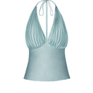 Blue pleated top from Stolen Stores, styled as a casual women's fashion top with a modern pleated design.