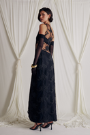 Elegant VITA GOWN by Somebodée featuring flowing fabric and intricate details, showcased on a mannequin.