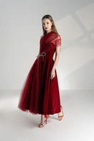 Happy Clothing Leslie fit and flare crossover mesh taffeta midi gown with elegant design and flowing silhouette.