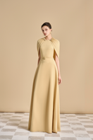Maison Des Copains jasmine A-line cape-sleeved floor-length gown with flowing fabric and elegant design, perfect for formal occasions.