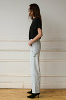 Blue Jade Jeans by TT Studios, showcasing classic denim fit with visible stitching and five-pocket design.