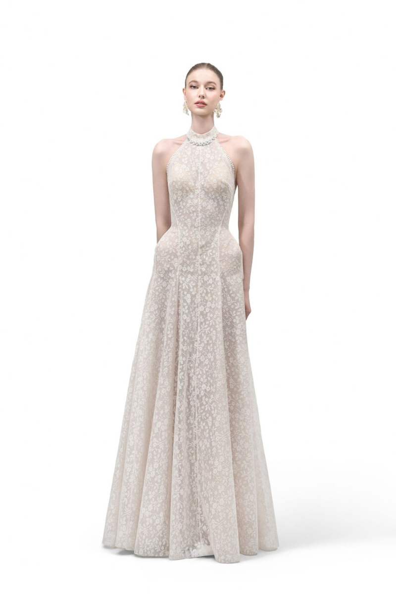 Maison Des Copains Aurelia A-line halter neck gown with a sleek, floor-length black design and elegant silhouette.