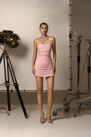 CEM Zaylee strapless draped crepe mini dress with fitted bodice and flowing skirt, shown on a model.