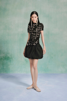 Laser cut satin top from LECIA, featuring intricate design details and a sleek satin finish, perfect for stylish casual wear.