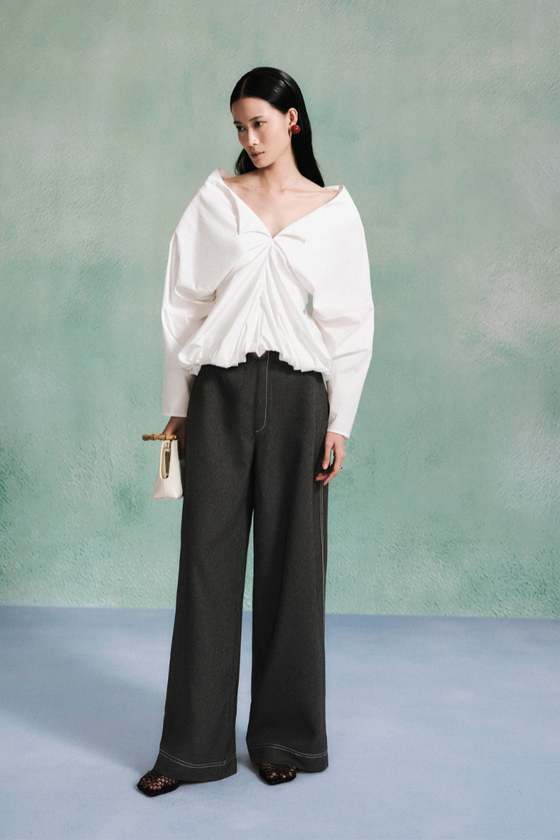 Light blue cotton denim pants from Lecia V-Waist collection, featuring a relaxed fit and classic five-pocket design.