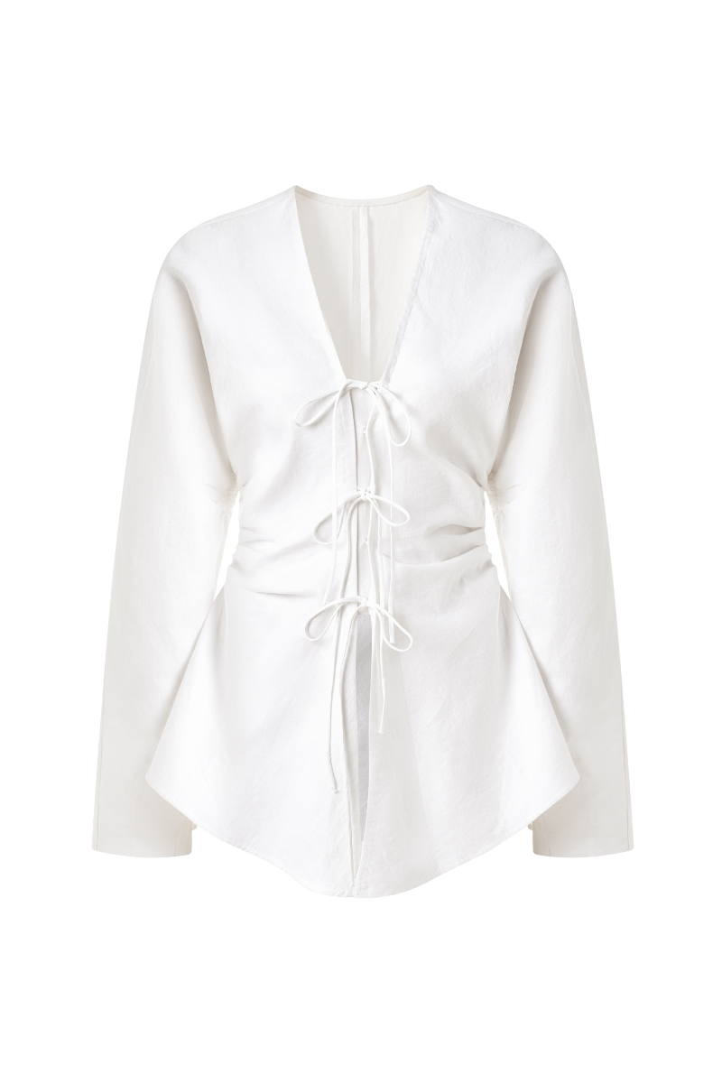 Leicia linen long sleeve shirt, lightweight and breathable with a relaxed fit, shown in natural color on a hanger.