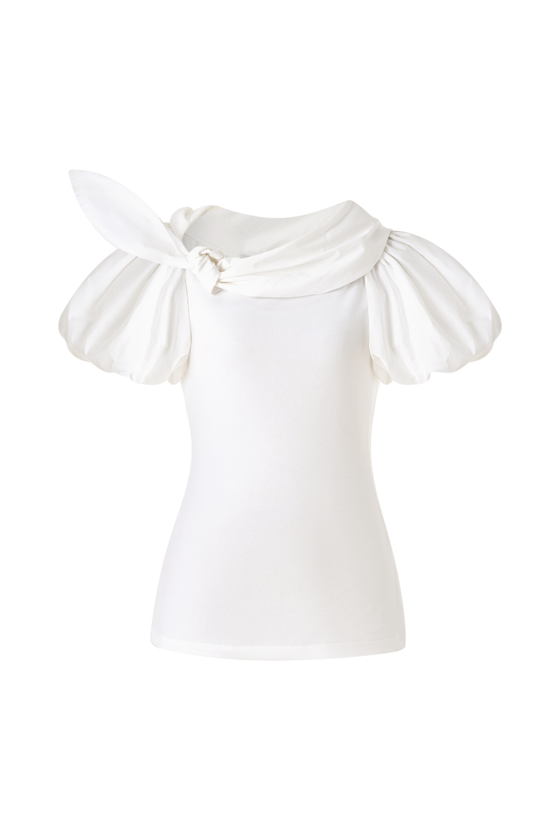White puff sleeve cotton top by Lecia, featuring a relaxed fit and soft fabric, displayed on a hanger.