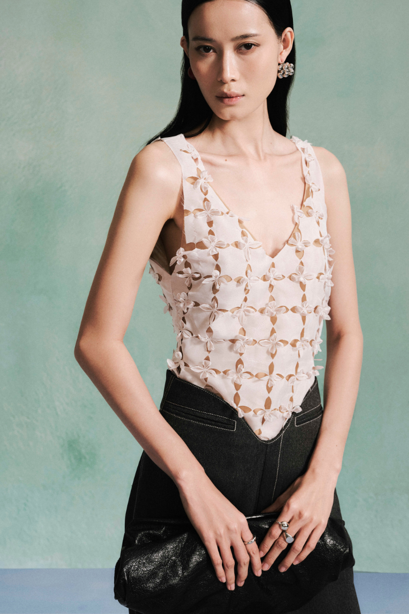 LECIA laser cut mesh silk chiffon tank top featuring delicate, semi-transparent fabric and intricate cutout design.