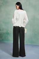 Light blue draped balloon blouse from LECIA, featuring a relaxed fit and soft fabric, displayed on a mannequin.