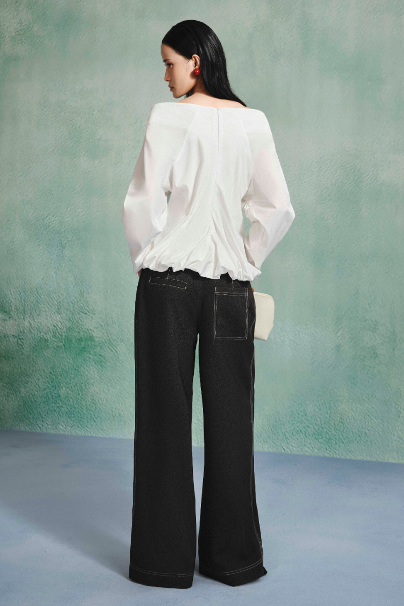 Light blue draped balloon blouse from LECIA, featuring a relaxed fit and soft fabric, displayed on a mannequin.