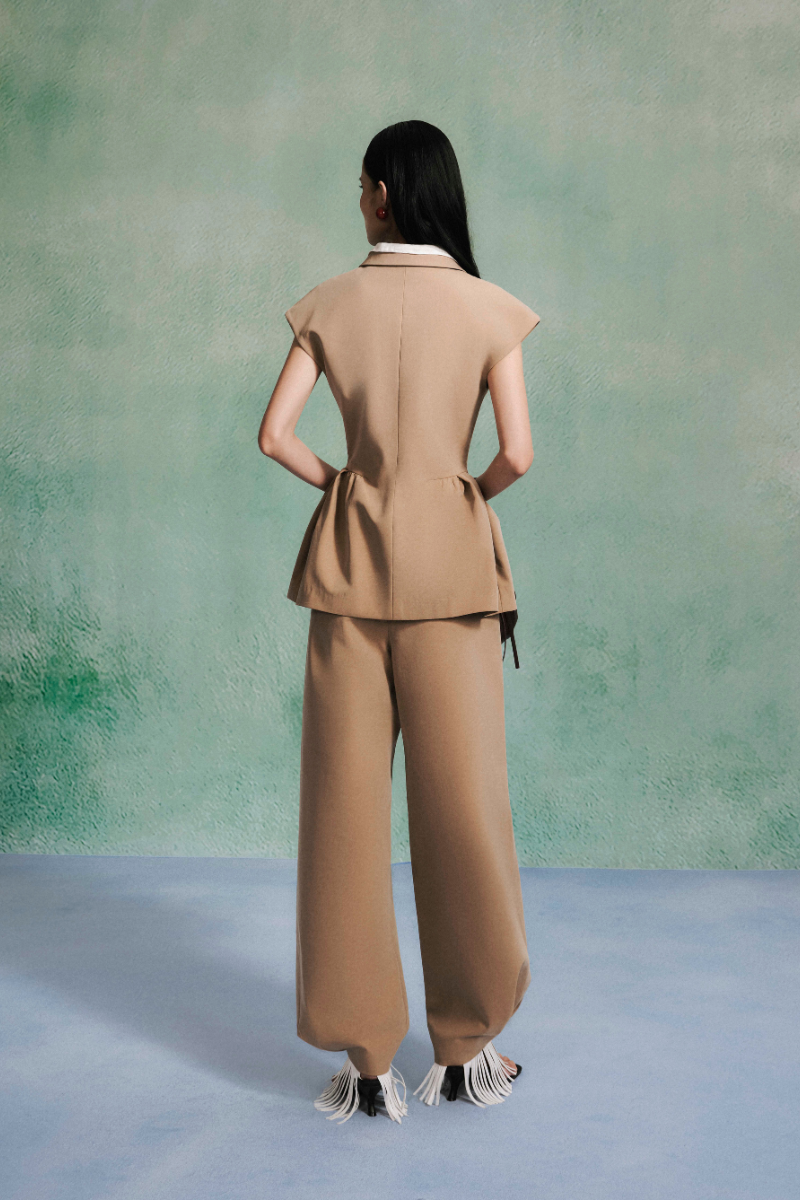 Lecia Curve Mocha Pants featuring a relaxed fit and stylish design, shown in a natural pose highlighting the fabric and color.