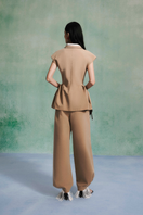 Lecia mocha peplum top, stylish sleeveless blouse with fitted waist and ruffled hem, perfect for casual or dressy outfits.