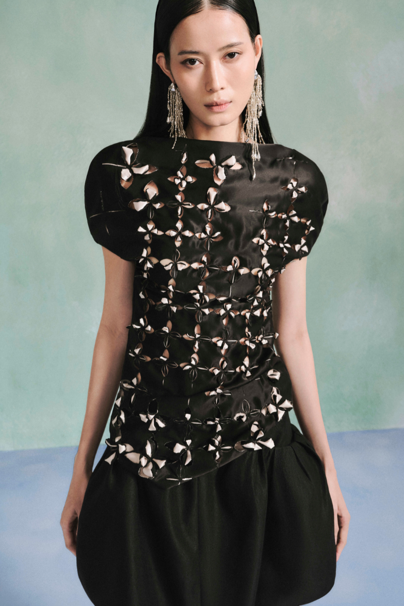 Laser cut satin top by LeCia, stylish women's top featuring intricate cutout details and smooth satin fabric.