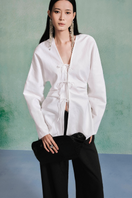 Light beige Lecia linen long sleeve shirt with a relaxed fit, featuring a classic collar and button closure.