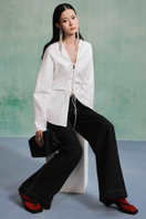 Lecia linen long sleeve shirt with a relaxed fit, featuring a classic collar and soft fabric in a neutral color.