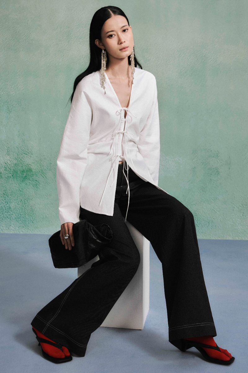Lecia linen long sleeve shirt with a relaxed fit, featuring a classic collar and soft fabric in a neutral color.
