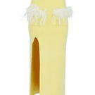 Yellow vanilla knit midi skirt with feather details from Andreeva, showcasing a textured knit fabric and feather accents.
