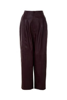 Japanese leather pants in wine red by MAZ Manuela Álvarez, showcasing their sleek fit and rich color.