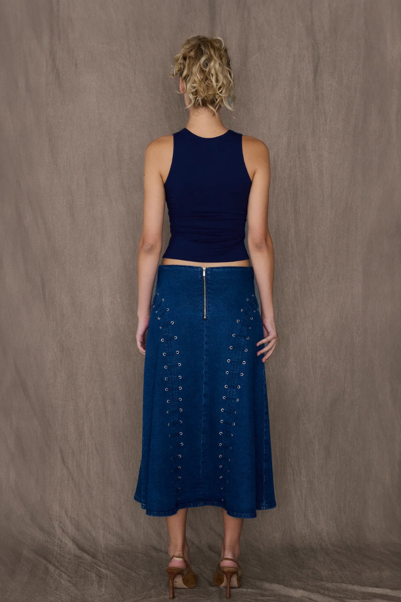 TT Studios JAN midi skirt, stylish and flowy, shown in a natural fabric with a sleek design perfect for casual or dressy occasions.
