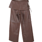 Brown leather pants by Double A featuring a stylish fit, shown on a model with detailed stitching and a sleek design.