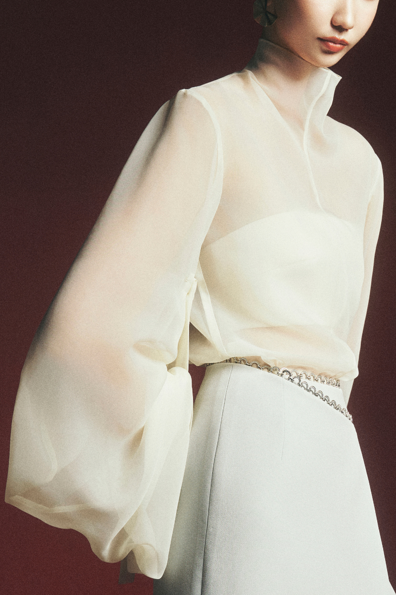 Maison Des Copains Arnold wrap front slit midi skirt displayed with a flowy fabric and a stylish slit detail.