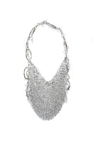 Millanne Tale glass shoulder bag with transparent design and stylish handle, perfect for modern fashion accessories.