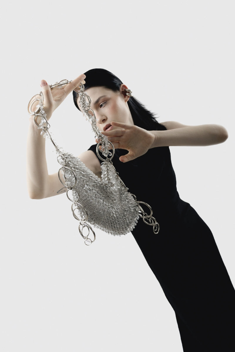 Elegant glass bag shoulder bag by Millanne Tale featuring a transparent design and stylish shoulder strap.