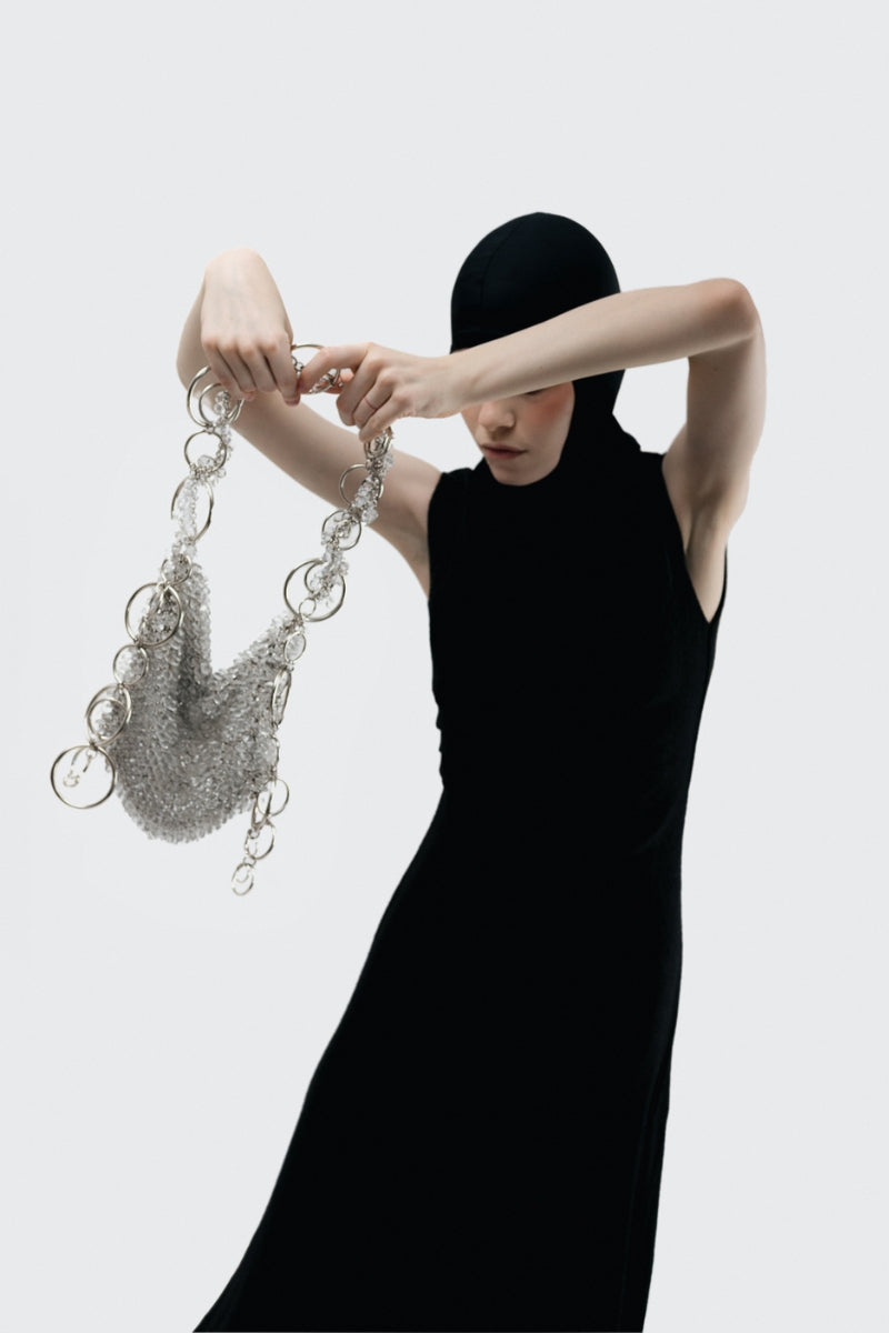 Millanne Tale glass shoulder bag with transparent design, featuring sleek, modern style and minimalist details.